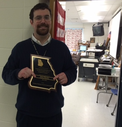 Sean Hickey, who received the Speech Coach of the Year award at the state speech and debate tournament, has been coaching the team for seven years. While in high school, Hickey was a member of the team.