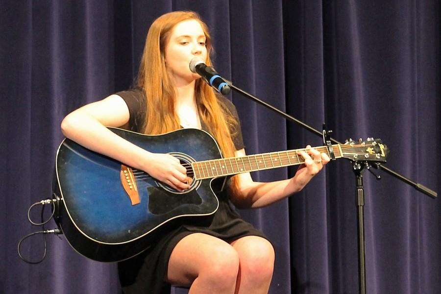 Freshman Morgan Beck played her guitar and sang Parachute by Ingrid Michaels. 