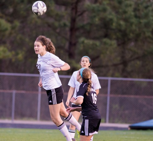 Junior Lauren Yoss heads the ball in the Lady Panthers game against Northgate. 