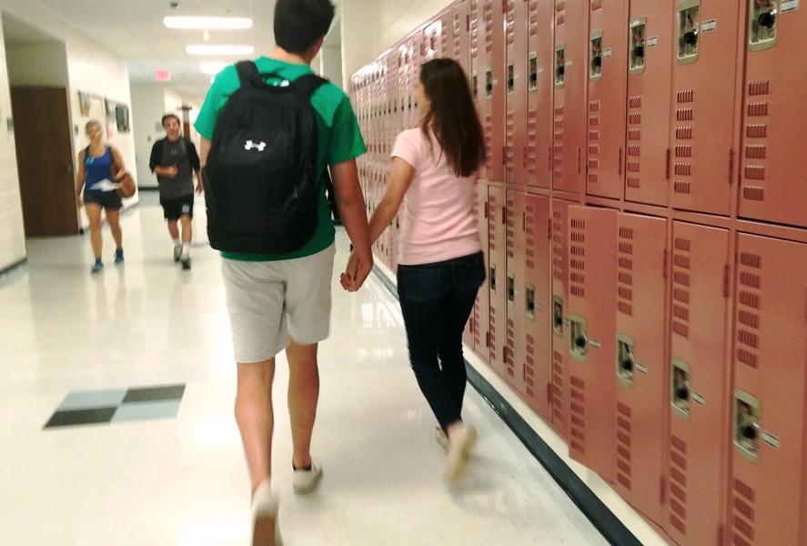 Teenage sweethearts Jordan Hall and Natalie Ellison are blind to their surroundings as they walk down the hallway hand in hand. 