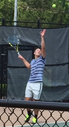 Junior Dubie Dubin serves to his opponent from Lakeside Evans in a singles match at the tennis state championship. He lost his matches, 6-3 and 6-0.