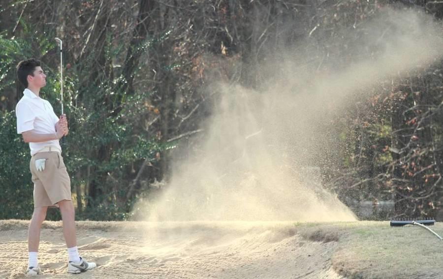 Senior and Ole Miss recruit Parker Langham hits a tough bunker shot during a tournament against Spalding County. Langham shot a 37, the best score of the team. 