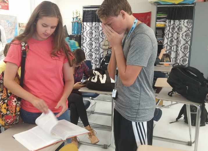 Upperclassmen discuss their upcoming AP Government and Politics test at the beginning of class. Both students participate in Panther Pride marching band, and they performed at the Oconee Classic marching competition over the weekend, winning Grand Champions, but not arriving home until 11 p.m. Sunday night. 