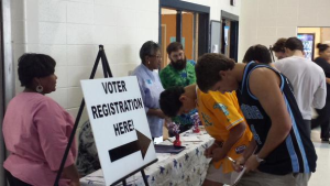 Seniors fill out voter registration forms in the cafeteria. Registration was available to all students ages 17 and a half and older during lunch on Sept. 24-25.