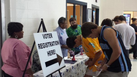Seniors fill out voter registration forms in the cafeteria. Registration was available to all students ages 17 and a half and older during lunch on Sept. 24-25.
