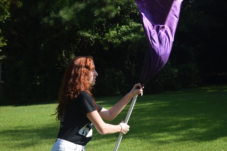Sept. 11, 2015 - Color guard members work on their routine after school.  They prepare for upcoming performances with the band. The Fayette County Marching Band Exhibition will be at 6 p.m. on Sept. 21 in Panther Stadium.