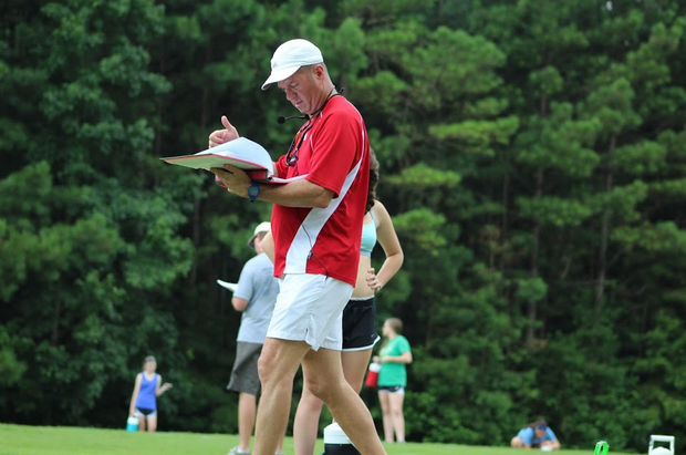 Band director Scott King prepares his students for the 2015-16 marching show by checking the placement of the band members on the field during an after-school practice.