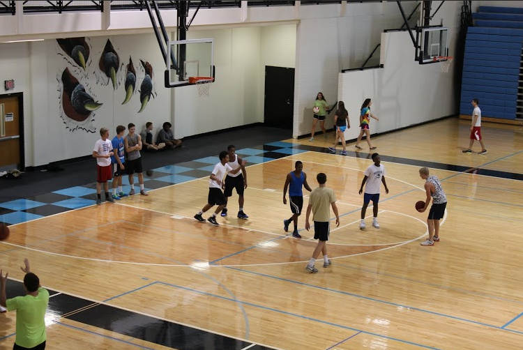 Sept. 11, 2015- After a long day of academic classes, students in Chad Walker’s seventh period Team Sports class have fun playing friendly games of basketball and volleyball in the gym.