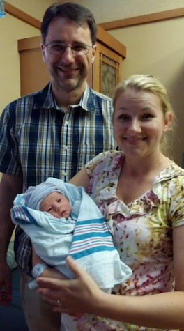 Math teacher John Bowen and English teacher Jillian Bowen hold baby Katherine just three hours after she was born. 