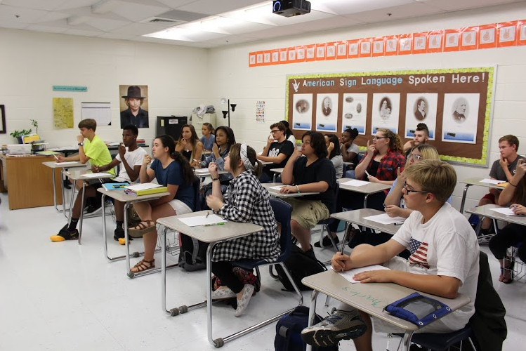 Sept. 10, 2015- Students in Julie Karneboge’s seventh period American Sign Language class practice signing “who” for their upcoming quiz.