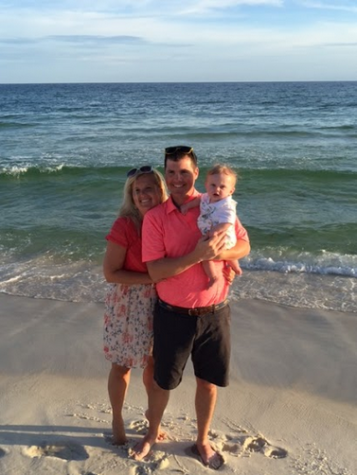 History teacher Shane Ratliff and Learning specialist Mandy Ratliff pose with baby Sawyer on their family vacation at Panama City Beach.