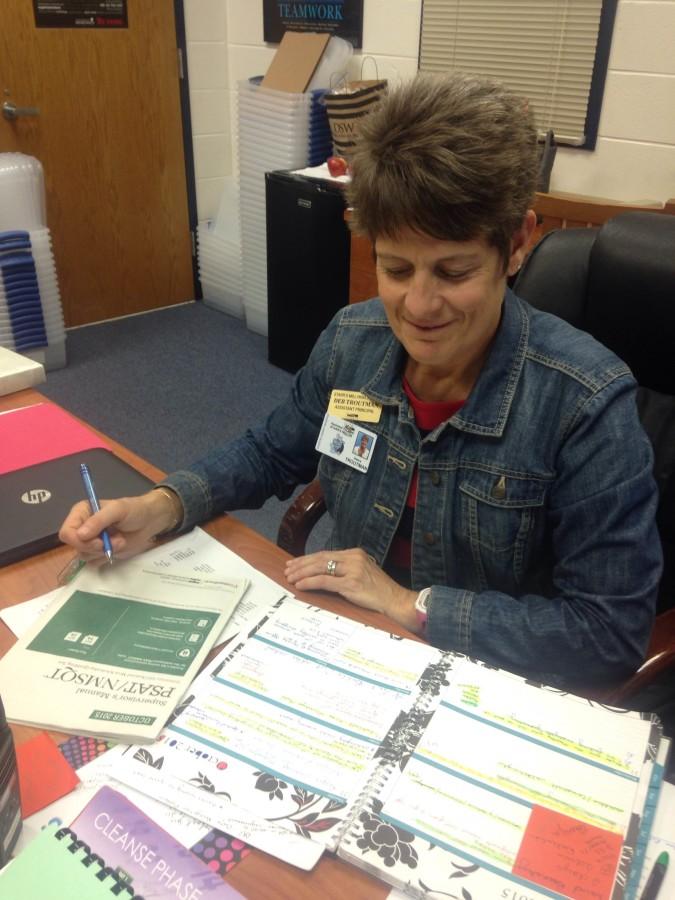 Assistant principal Deb Troutman works on scheduling the PSAT proctors so all teachers still have one planning period during the Oct. 14 testing. 