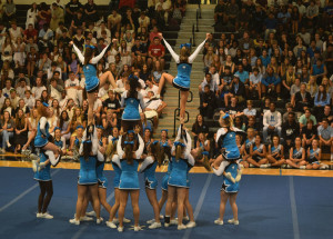 Cheerleaders perform their routine at the pep rally on the Friday of homecoming week. The cheerleaders competed on Sept. 19 and Oct. 3, earning the grand champions title at East Coweta and first place at Putnam. 