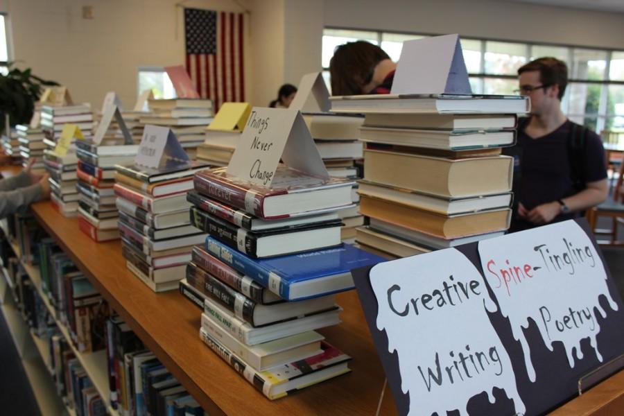 Oct. 28, 2015 - Students in Jillian Bowen’s Advanced Creative Writing class construct poems with the titles on the spines of library books. These poems are currently on display in the media center.