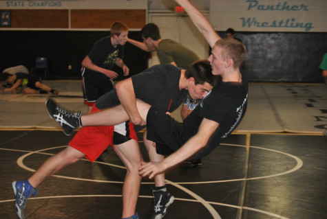 Wrestlers work on rounds in the field house during an after school practice. Their first tournament was Nov. 14, but they had to forfeit four weight classes because the team didn’t have enough wrestlers for every class, especially with some wrestlers still playing football.