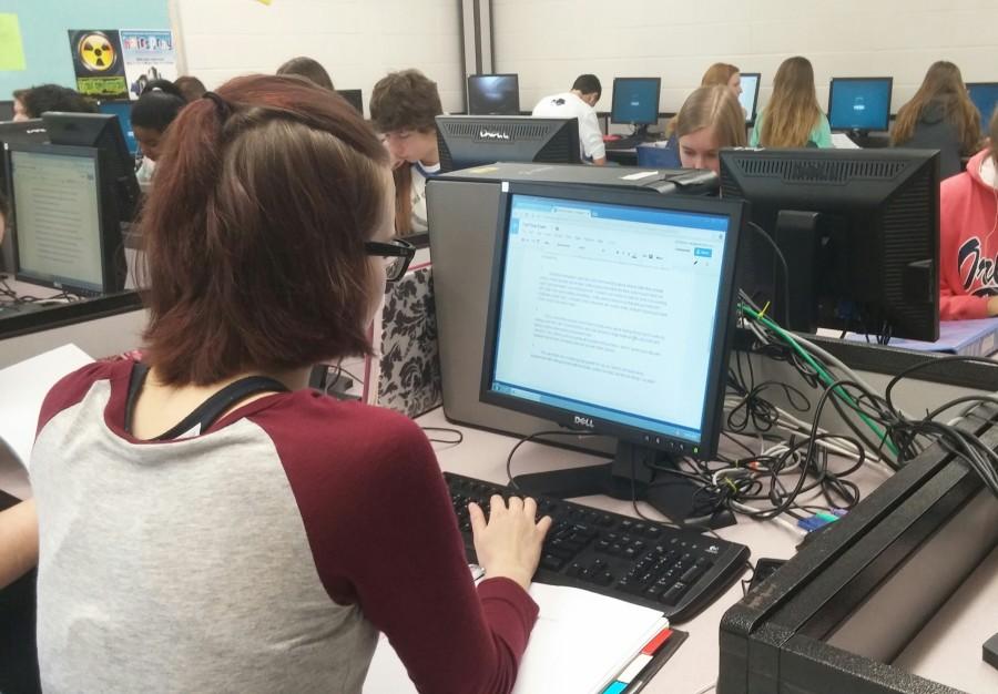 Freshman Ally Marlow sits in front of a computer screen for two hours taking her Writers Workshop final exam.  Currently, students with five or fewer occurrences, excused or unexcused, can exempt one exam on attendance if they have a 71% or higher in the class.