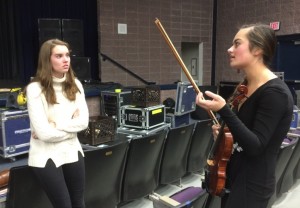 Hollyn Shadinger discusses the upcoming Miss Starr’s Mill Pageant with fellow contestant senior Maddie Beatty during one of their practices.