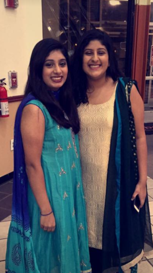 Senior Arisha Ali and junior Aliza Ali smile with excitement in the Atlanta Global Mall lobby, ready to kick off Helping Organizations and People Everywhere’s first-annual Garba, wearing traditional shalwar kurtars and ready to introduce their friends to the culture. 