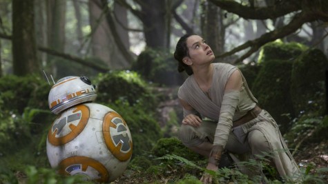 Rey (Daisy Ridley) and BB-8 watch as a First Order fleet circles above the planet Takodana in pursuit of information on Luke Skywalkers (Mark Hamill) whereabouts. 