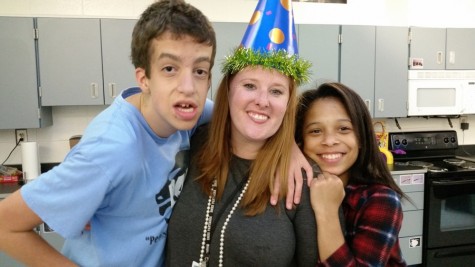 Adaptive curriculum specialist Courtney Savage and two of her students celebrate her birthday with cake and party hats. Savage said that she is honored to be chosen as Starr’s Mill’s teacher of the year. 