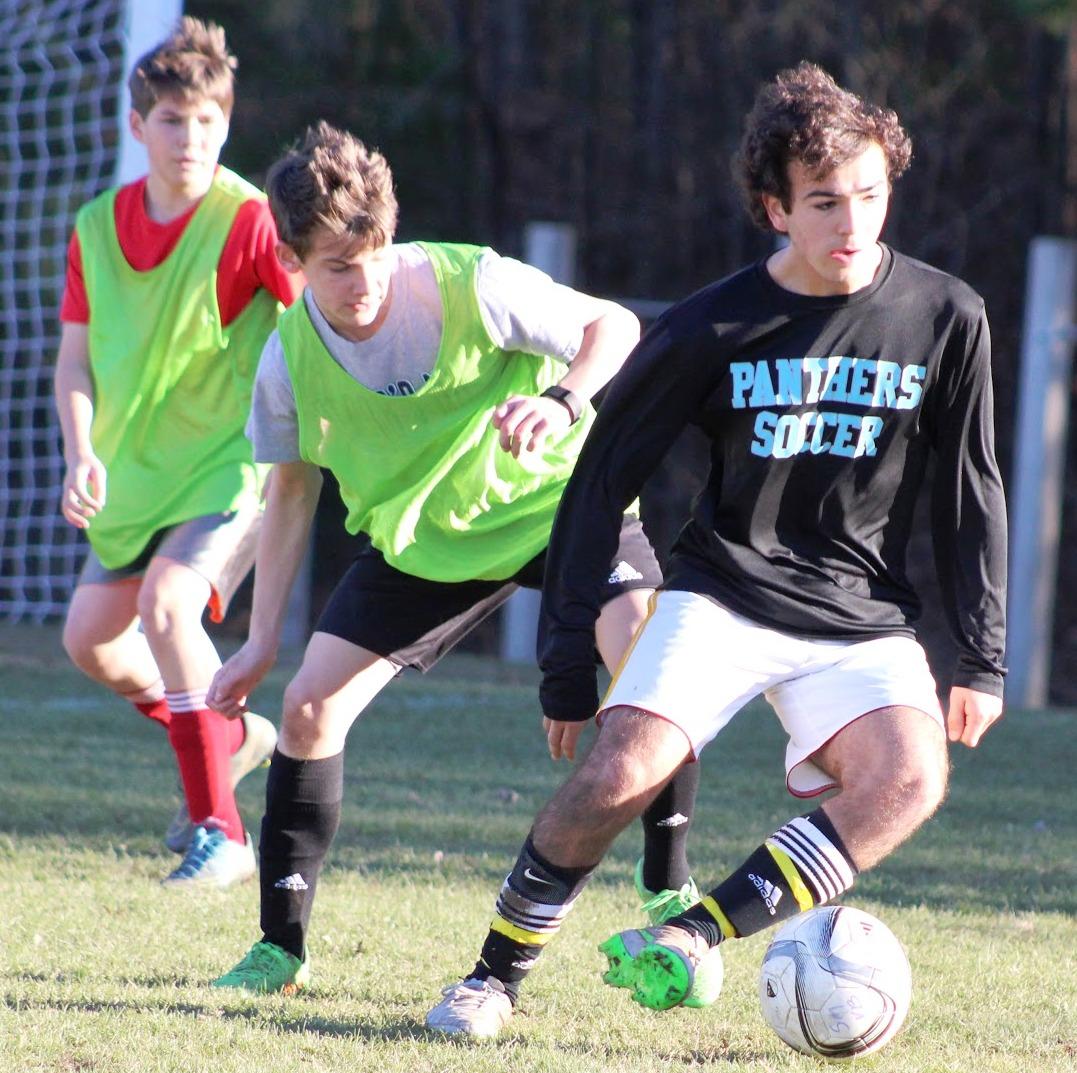 Jan. 29, 2016 - A boys soccer player dribbles the ball up the field in a scrimmage on Jan. 29. The boy’s season kicks off on Feb. 5 at home against Pope in a non-region game.
