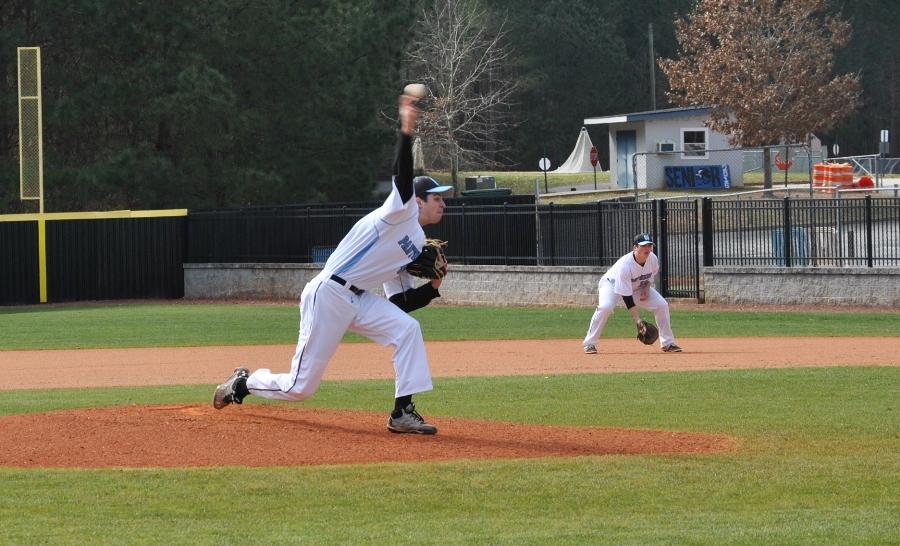 Feb. 6, 2016 - Junior right-handed pitcher Jordan Hall delivers a pitch while sophomore first baseman Hayes Heinecke backs up the play.