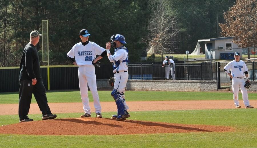 Feb. 6, 2016 - Head coach Brent Moseley confronts senior pitcher Jared Kumro and senior catcher Joe Gruska at the mound.