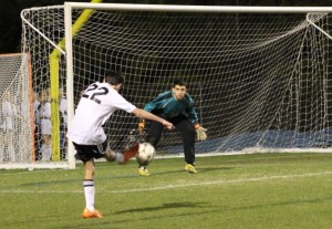 Feb. 25, 2016 - A Panther soccer player launches a shot toward the Sandy Creek Patriot keeper. The Panthers dominated on the offensive side of the ball, winning the match in a 4-0 shutout.