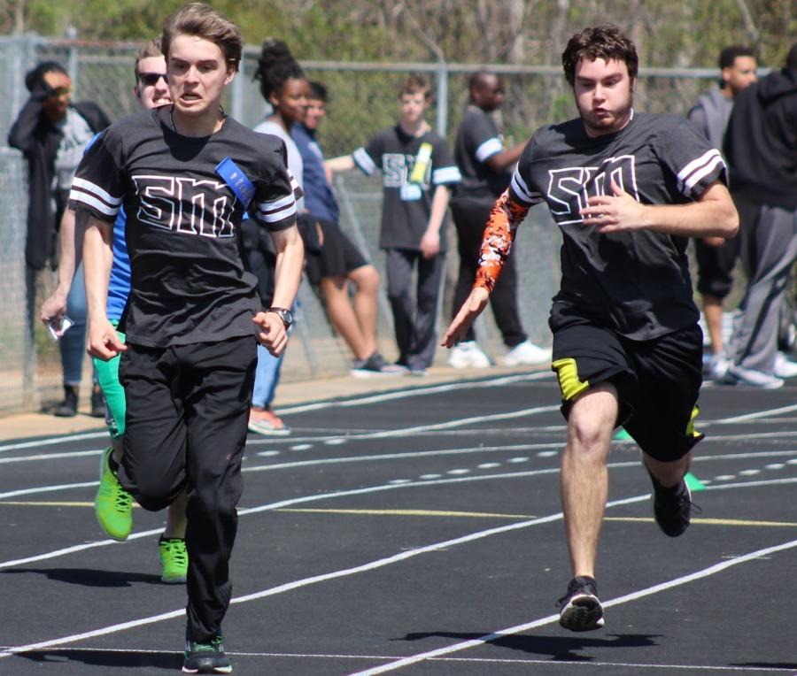 A heat of athletes run their 100 meter dash event. Athletes could also participate in the 50 meter dash, softball throw, shot put and long jump at Special Olympics.