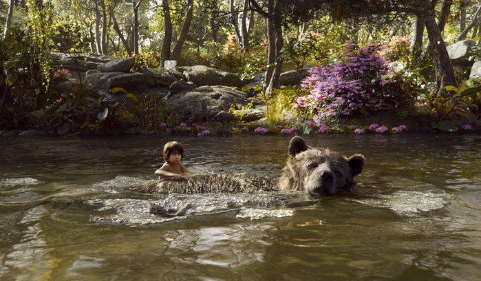 Mowgli+%28Neel+Sethi%29+and+Baloo+%28Bill+Murray%29+float+down+the+river+singing+the+%E2%80%9CBare+Necessities.%E2%80%9D+Regardless+of+slight+changes+to+the+story%2C+the+song+ties+together+some+of+the+similarities+between+the+cartoon+and+the+new+live-action+film.