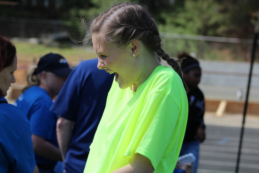 March 23, 2016 - A student from the National Honor Society enjoys blowing bubbles with the Special Olympics athletes in the Panther Stadium at the Olympic Village activity tent. The mission of the Fayette County Special Olympics is to provide sports training in several Olympic-type sports for people 8 years of age and older with intellectual disabilities, giving them opportunities to develop physical fitness and participate with other Special Olympic athletes and the community. 
