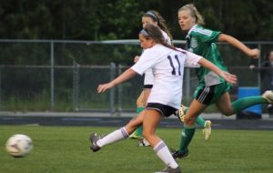 Avoiding the McIntosh defense, a Lady Panther kicks the ball down the field.  In the 3-2 win, the Lady Panthers defeated their 11th-straight region opponent and captured the region championship.