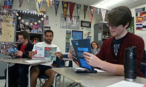 Seniors Dhruva Jandhala, Evan Johnson and Ricky Macke study packets at practice for the annual economics challenge held at the Atlanta Federal Reserve Bank. The advanced placement econ team placed sixth in the state at this year’s competition, and the college prep team came in third. 