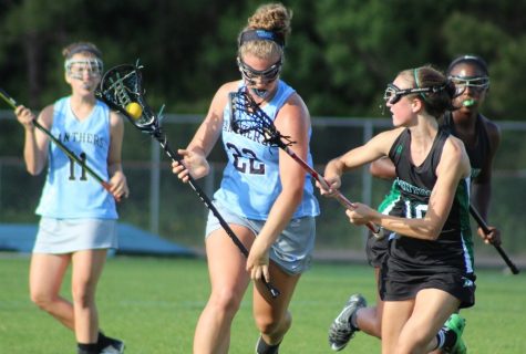 A Panther player charges down the field in the first half of a game against McIntosh. Senior Alyssa Sack led the way in the game, scoring four goals in the first half and assisting on another. The 18-10 win clinched the region championship and puts the Panthers at 10-5 overall and 8-0 in region play. 