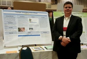 April 2, 2016 -Freshman science fair competitor poses next to his completed project at the Georgia Science and Engineering Fair. His project placed third at the state competition along with an award for ingenuity.