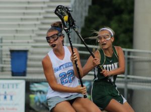 A Panther player spins by a Blessed Trinity defender. The Panthers offense struggled and turned the ball over multiple times, creating quick scoring chances for the visiting Titans.