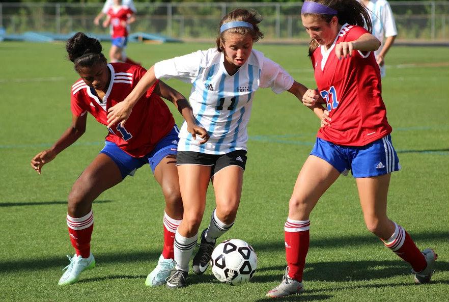 May 4, 2016 - A Lady Panther fights two players for the ball. Starr’s Mill posted two goals in an offense-heavy first half.  Starr's Mill posted two goals in an offense-heavy first half, but the tempo slowed in the second half. Despite the change of pace, the Lady Panthers were able to score two more goals when they turned back to a more aggressive approach.