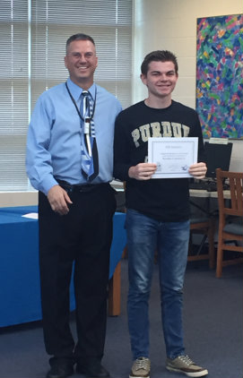 April 30, 2016 - Band director Scott King poses with a band signee after the signing day ceremony. The signee’s trombone talent earned him a spot in Purdue University’s All-American Marching Band.