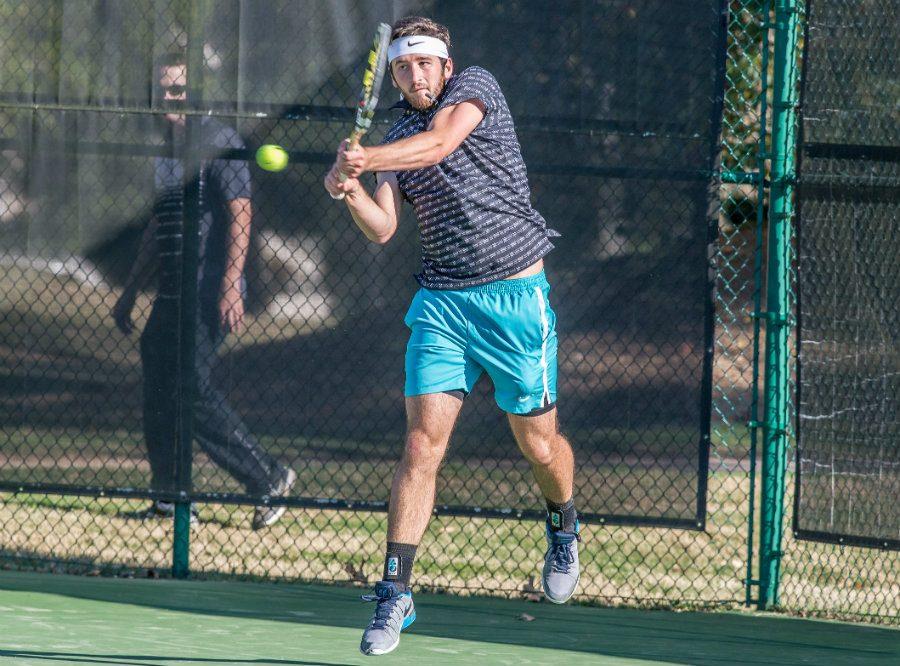 A senior jumps to send the ball flying back across the net with a backhand swing. With the boys’ team graduating eight seniors, head coach Ronald Mann will look to the remaining underclassmen to continue the team’s impressive region record and post-season success.