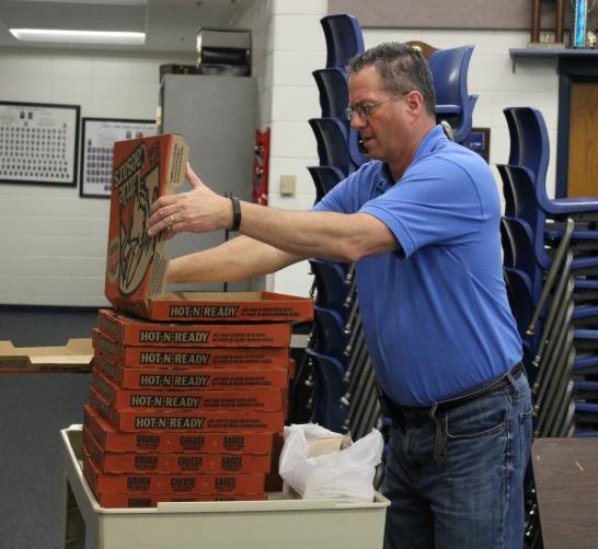 April 21, 2016- Band teacher Scott King and assistant band teacher Christopher Johns host a small pizza party in the band room to show appreciation to all the band students who performed for the soccer game against McIntosh on April 15. The girls soccer team scored a 3-2 win against the Chiefs at “The Battle of the Bubble.”