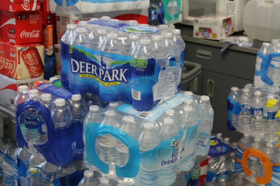 April 23, 2016- Band teacher Scott King and jazz band stock up on water and other drinks to keep cool and hydrated during the Spring Sampler festival. The Mill’s band performed for the festival on April 23 at the Fred Amphitheater.