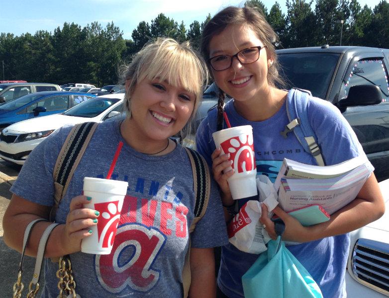 Ready+to+start+their+morning+right%2C+two+students+walking+to+check-in+have+smiling+faces+with+Chick-fil-A+in+hand.+%E2%80%9CI+think+I+enjoy+Chick-fil-A+so+much+because+it+offers+quality+fast+food%2C%E2%80%9D+senior+Michaela+Cushing+said.+