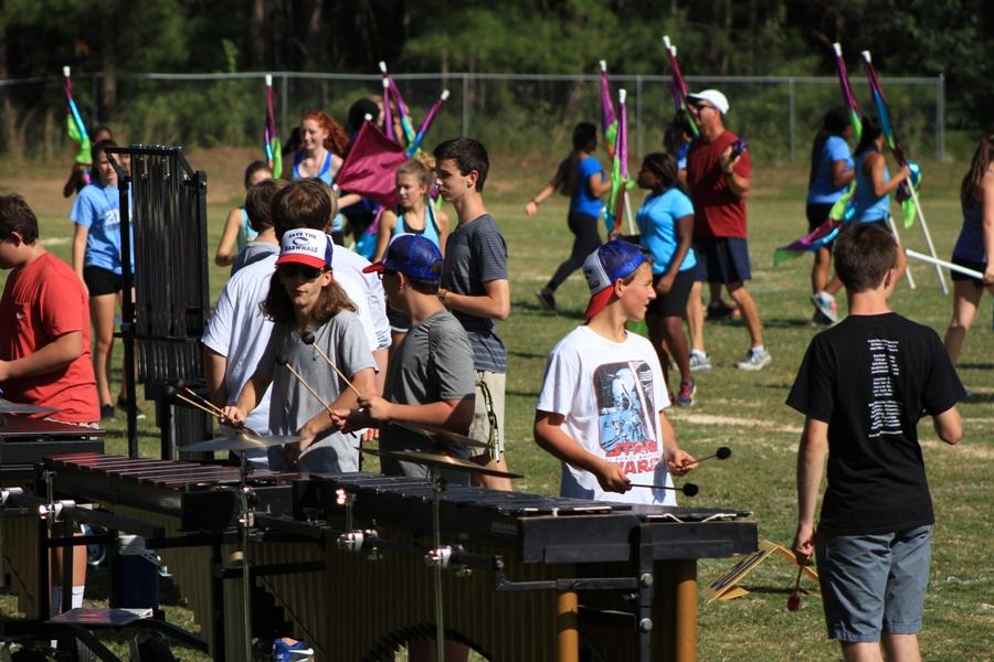 Percussionists play their music for the show during practice after school. “I like how the first movement is very much percussion based. The drumline music is great,” senior percussionist Adam Warner said.  