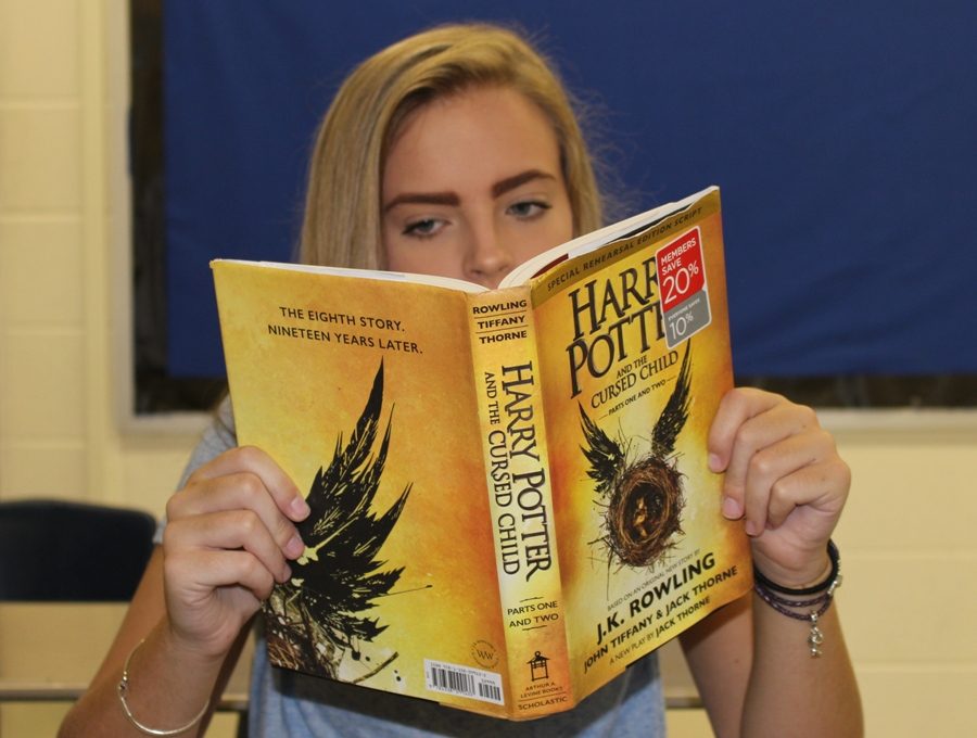 Aug. 25, 2016 - A student reads the newest Harry Potter story, Harry Potter and the Cursed Child. Published on July 31, this novel uses a play script format rather than the prose format used in the first seven Harry Potter books.