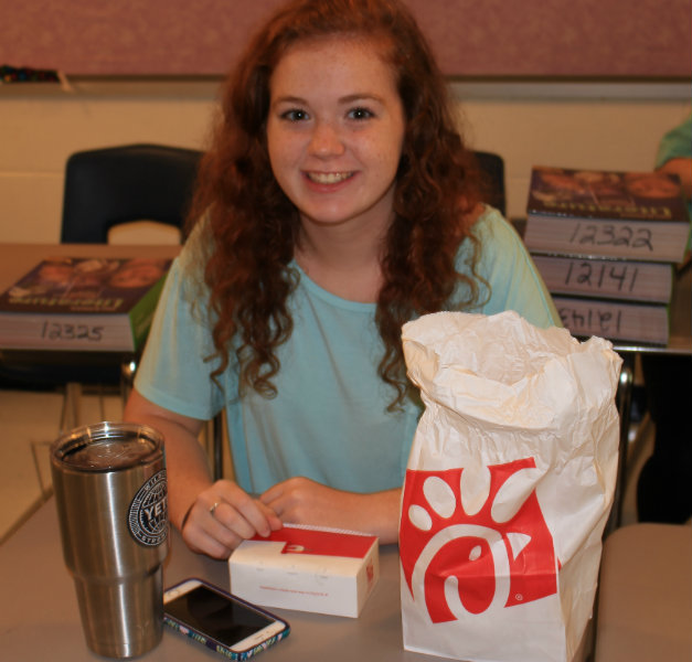 Before the bell rings for Jillian Bowen's Literature Types and Composition class, a student begins to open her eight-count ‘Chikin-mini’ order. “My order typically depends on my mood,” junior Aurelia Slay said.