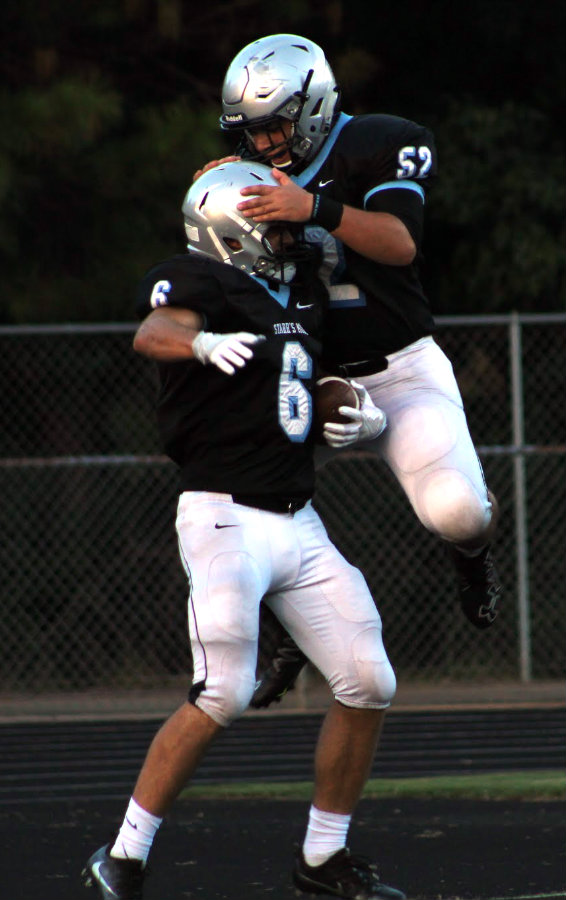 Aug. 12, 2016 - Two Panthers celebrate a touchdown in an aerodynamic manner during the first half of Friday’s scrimmage. The Panthers ran the ball effectively against the Wildcats, leading to a 17-14 victory.