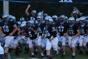 Aug. 12, 2016 - The Panthers run onto the field before the game against Locust Grove. The Panthers had a 14-0 lead early, but gave up two touchdowns in the second half before kicking the winning field goal.