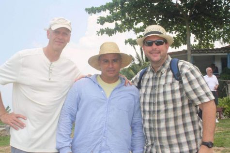 Economics teachers Walter Ellison and Mark Decourcy stand on a local farm in Viñales, Cuba, next to its property owner. Ellison and Decourcy voyaged to Cuba this past summer looking for hands-on economic insight of how a command economy functions around its citizens.