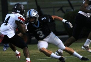 Sophomore Carson Walter attempts to tackle a Patriot running back. Sandy Creek’s running backs accounted for 353 of the Patriots’ 460 total yards.