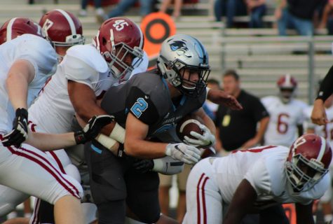 Junior Cole Gilley hits the ground after being tackled by a Northgate Viking linebacker. Gilley had 124 yards on 22 carries against the Vikings.